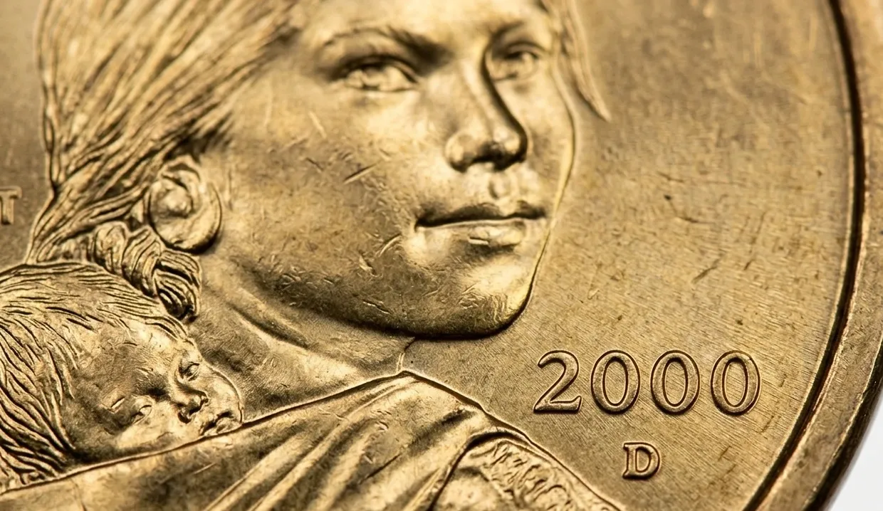 Macro shot of 2000 Sacagawea dollar coin showing date and lettering